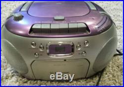 Emerson portable stereo in Purple with CD and tape player and AM FM stereo